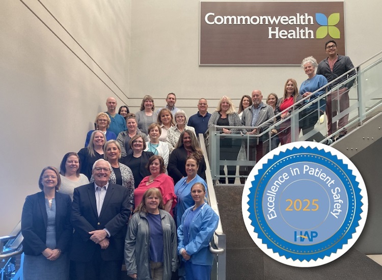 staff posing on stairs